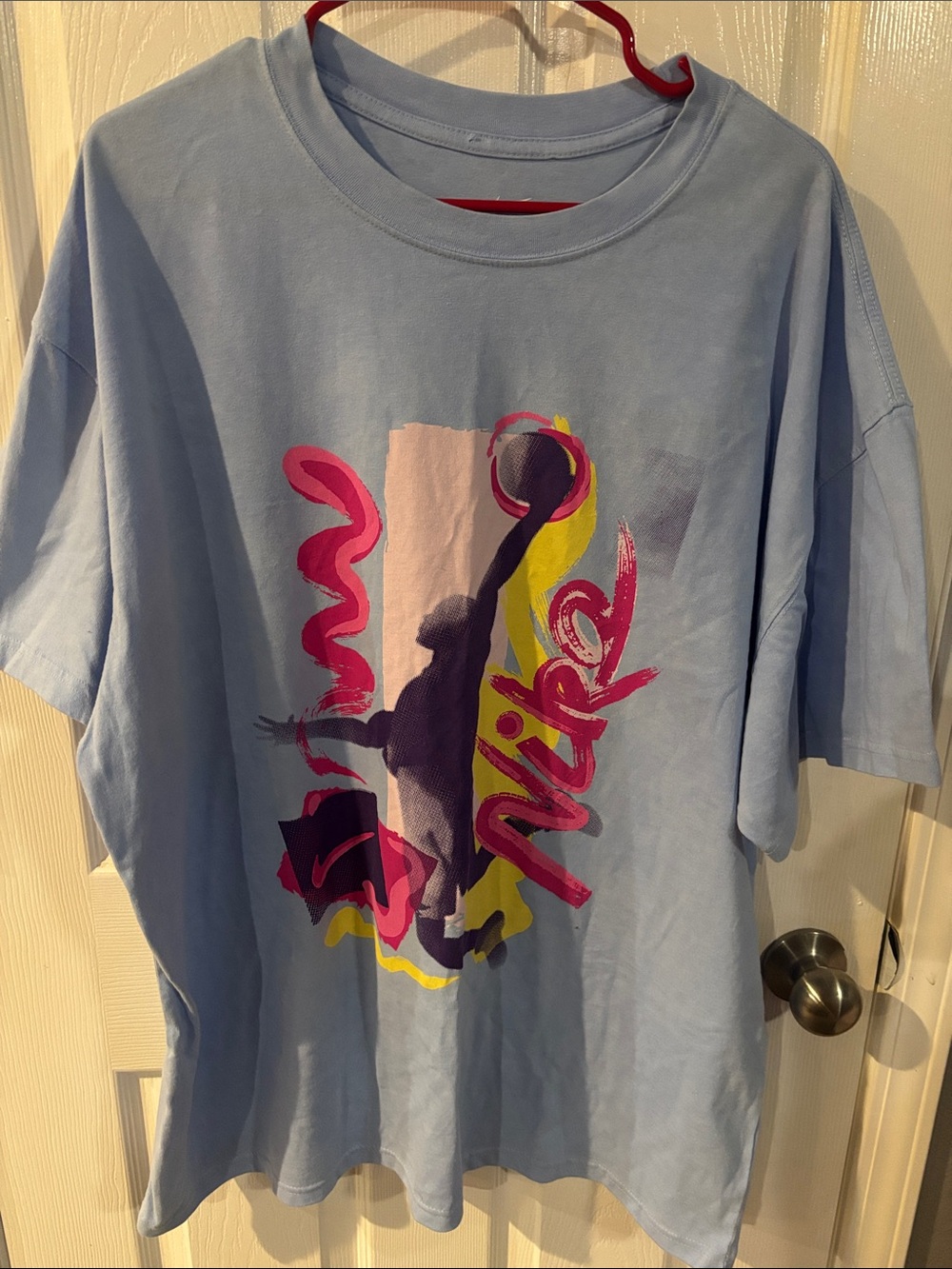 Nike Light Blue Tee with Pink, Yellow & Purple Graphic